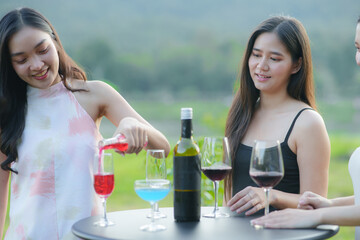 Asian women celebrate, meet and talk in bars. Tourist attractions, beautiful lights