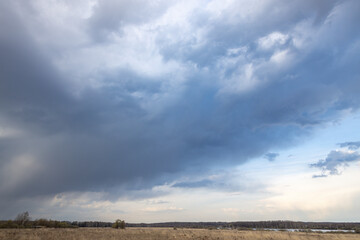 Cloudy sky with a storm brewing in the distance