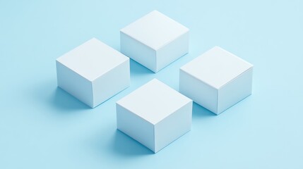 Fototapeta premium Four minimalist white paper boxes neatly arranged on a soft pastel blue background, perfect for displaying packaging designs and product concepts.