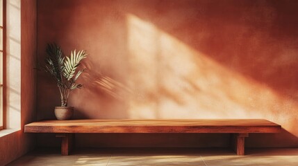Minimalist empty room with a wooden table and terracotta wall, offering a serene backdrop for product display and ample space for text integration.