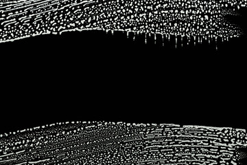 soap foam wipe marks on window glass, black background