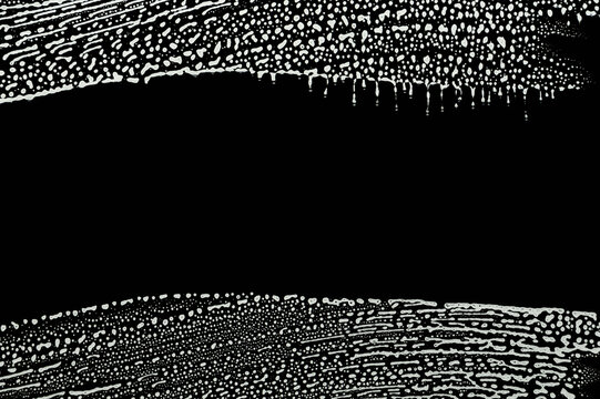 soap foam wipe marks on window glass, black background