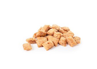 Pile of cat treats or snack. Heap of dry chicken treats for cats or dogs. Used for rewards, training or obedience. Yellow brown crunchy dry pet food. Selective focus. White background.