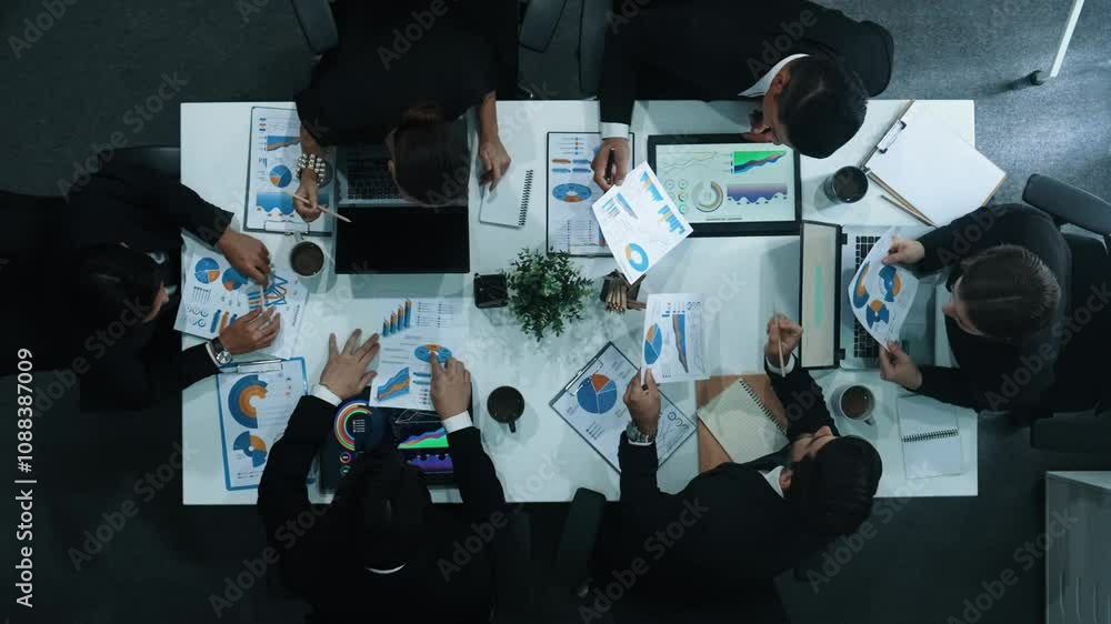 Aufkleber top down aerial view of business people discussing about financial strategy on table with document a