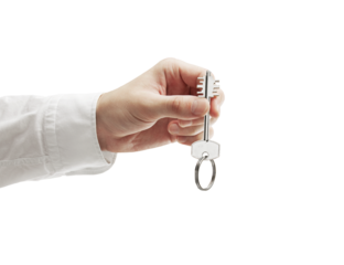 A closeup of a hand in a white shirt holding a house key. The scene is isolated on a white background. Symbolizes new home ownership or real estate