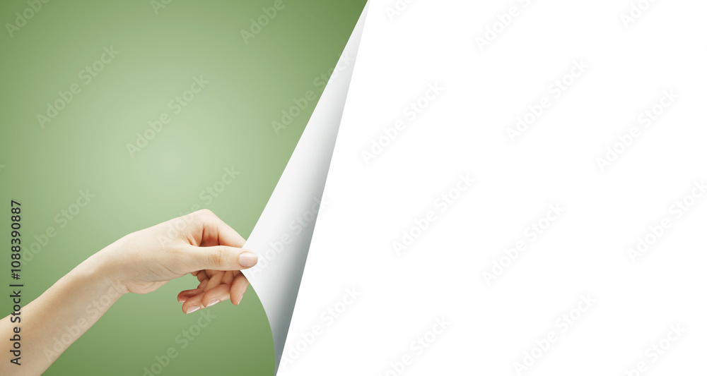 Poster a hand pulling back a green page to uncover a blank white space, isolated on a green background. rep