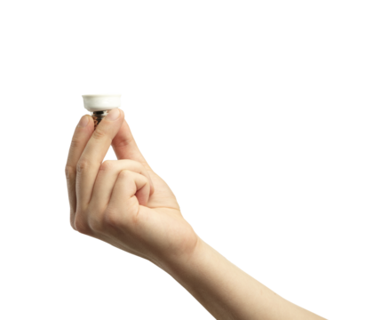 A closeup image of a hand holding a small lightbulb, isolated on a white background. A clean design template for product mockup or lighting concepts