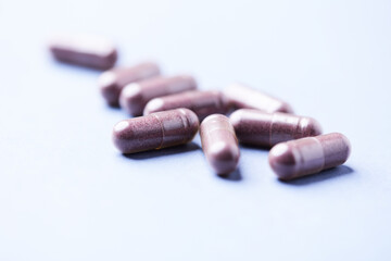 Lutein capsules. Dietary supplement on bright background. Soft focus. Close up. Copy space