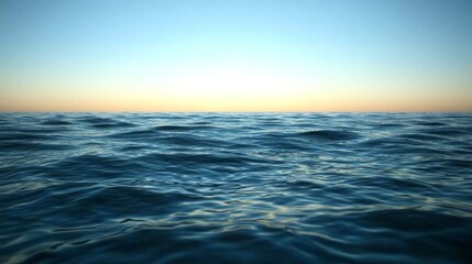 Obraz premium The ocean is calm and peaceful, with the sun setting in the background