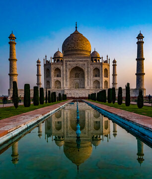 The iconic taj mahal basks in the early morning light, reflecting in the tranquil waters