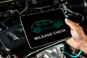 Check the maintenance mileage of used car , The display shows car maintenance checks on a tablet ,...