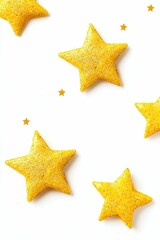 Glittery gold stars on white background.