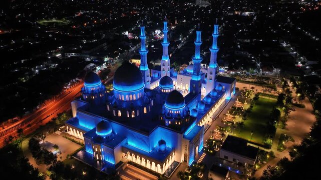 Majestic Great Mosque, Solo, Central Java. Islam, religious architecture and historic landmark. Drone night