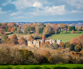 Autumn view of Bodiam castle from Ewhurst Green on the high weald east Sussex south east England UK 