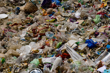 Closeup of a large accumulation of unsorted trash and debris at a garbage dump
