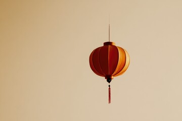 Obraz premium Elegant Red and Gold Paper Lantern Against Beige Background for Festive Decor