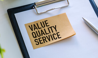 Text Value Quality Service on a sticker on a light blue background