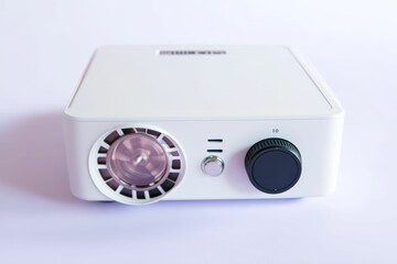 Obraz premium White projector with a lens and knob.
