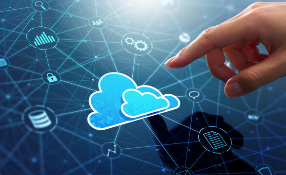 Cloud computing and SaaS technology. Transfer of data between application. Businessman touching cloud icon on network connection.
