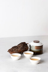 Oriental Tea ceremony concept, set of teapot and cups at white background, minimalist menu for teahouse