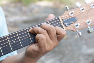 Christian guitar player strums with passion, their fingers crafting a soulful melody as the...