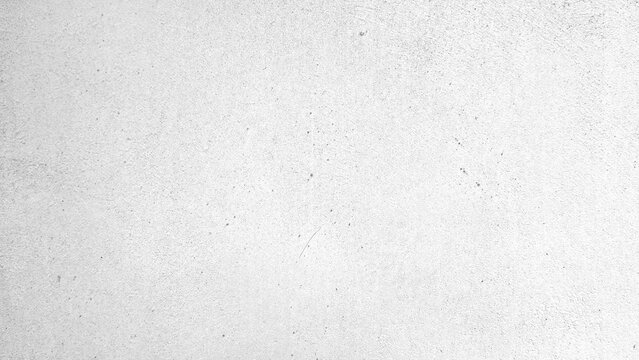 A high resolution image of a clean, white concrete wall with a subtle texture and minimal imperfections, ideal for backgrounds or design elements