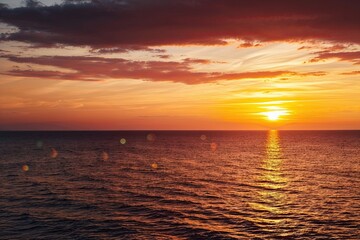 Fototapeta premium Stunning Sunset Landscape with Glowing Warm Light Effects