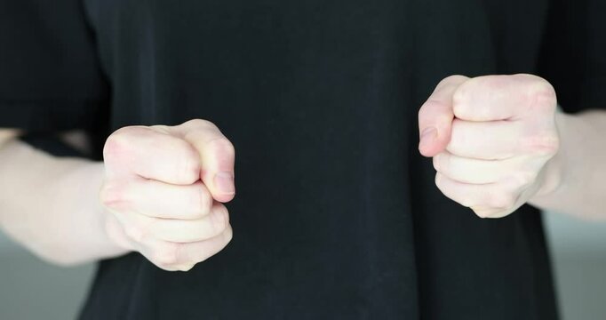 Confident aggressive angry businesswoman clenching fists