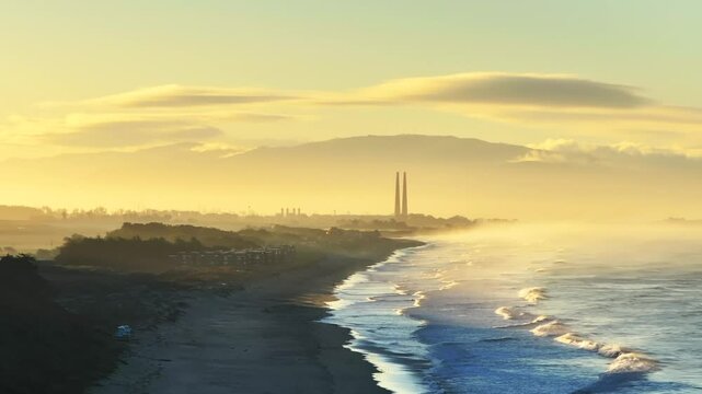 Moss Landing Powerplant Twin Towers warm sunrise morning mist seafog California aerial drone Sunset State Beach Pajaro Dunes Santa Cruz Manresa waves Monterey Bay Pacific Ocean circle left