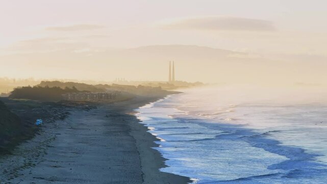 Moss Landing Powerplant Twin Towers sunrise early morning mist fog Pajaro Dunes California aerial drone Santa Cruz surfer waves sand Monterey Bay Pacific Ocean Manresa Sunset State Beach static shot
