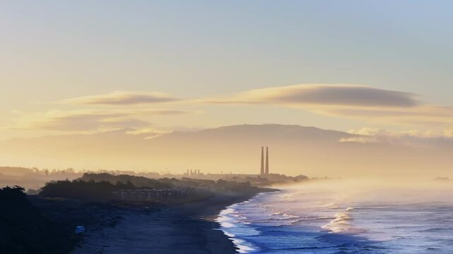 Moss Landing Powerplant Twin Towers warm sunrise morning mist seafog California aerial drone Sunset State Beach Pajaro Dunes Santa Cruz Manresa waves Monterey Bay Pacific Ocean static shot