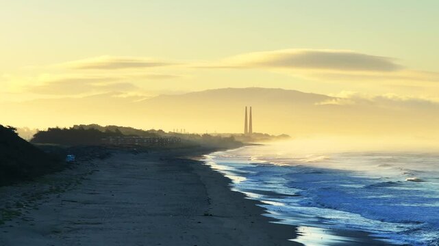 Moss Landing Powerplant Twin Towers golden yellow sunrise morning mist seafog Pajaro Dunes California aerial drone Santa Cruz Manresa Sunset State Beach waves Monterey Bay Pacific Ocean forward up