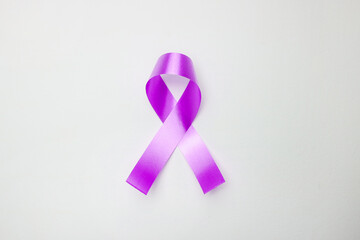 Pink ribbon on white background for supporting World Cancer Day campaign on February.