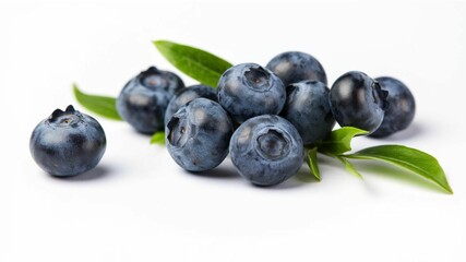 Fresh blueberries with green leaves on white.
