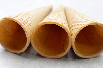 Waffle cones on grey background