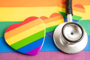 Stethoscope on rainbow flag background, symbol of LGBT pride month celebrate annual in June social, symbol of gay, lesbian, bisexual, transgender, human rights and peace.