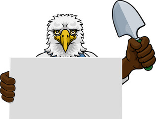 A gardener, farmer or handyman eagle cartoon mascot man holding a gardening tool