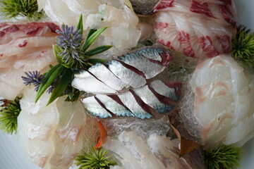 Fresh mackerel sashimi with a silvery sheen