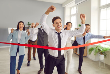 Business team leader entrepreneur runs race in office. Happy confident determined man runner...