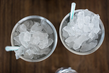 Gray stainless steel sublimation blank tumblers with full crushed ice and straw