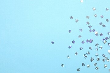 Beautiful silver confetti on a color background