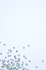 Beautiful silver confetti on a white background