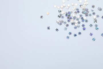 Beautiful silver confetti on a white background