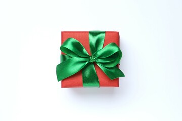 Beautiful gift box tied with bow on white background 