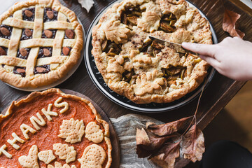 fall recipe preparation process of half-open apple pie with autumn leaves decor