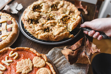 fall recipe preparation process of half-open apple pie with autumn leaves decor