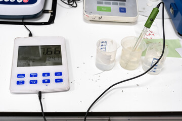 Close up view of scientist working with tubes and devices in laboratory.