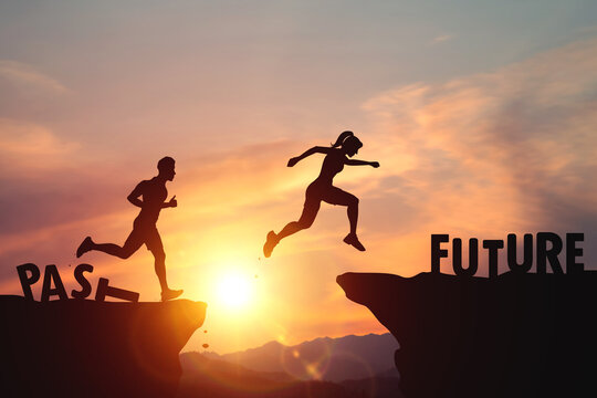 Self-improvement, past and future concept. Silhouette of person jumping between cliffs with words PAST and FUTURE on sunset light. Represents change, and determination to confidently move into future.