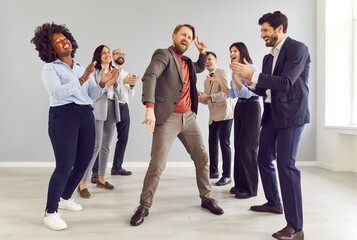 Office enthusiastic fun, dancing happy male worker got promotion celebrating success, pay,...