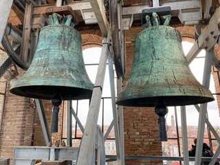 Two old big bells in church tower of Chioggia